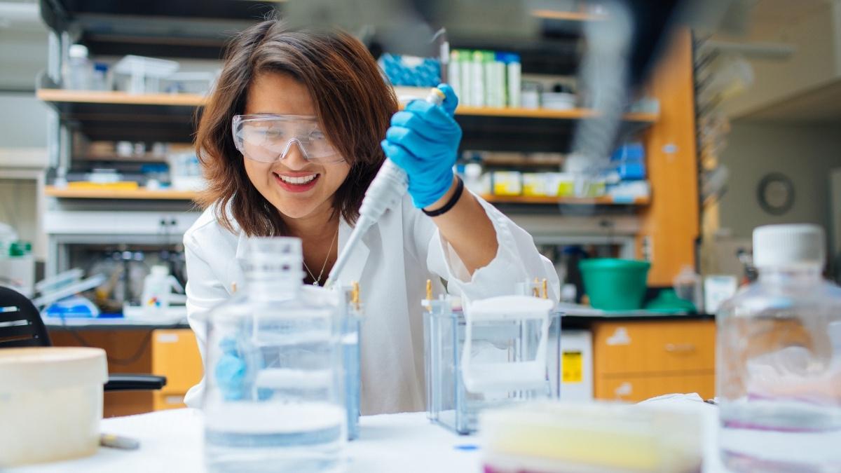 Female student conducting chemistry experiment