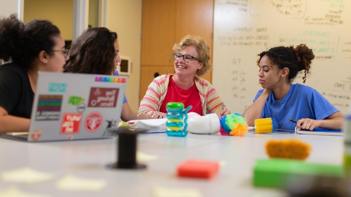 jane childers with students in lab