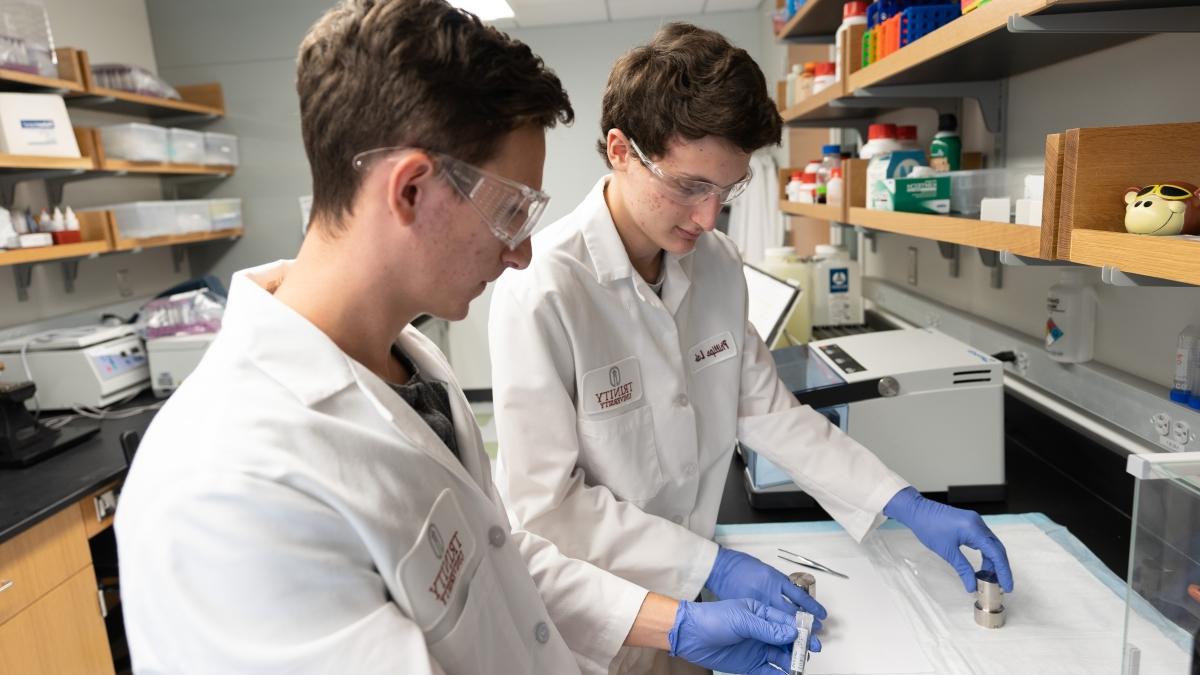 Two students working in a lab.